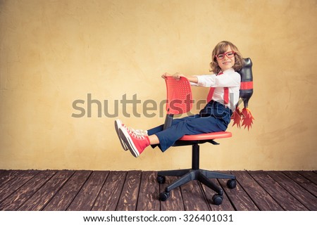 Portrait of young businessman with jet pack riding office chair. Success, creative and innovation technology concept. Copy space for your text