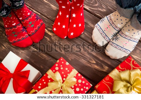 Feet of family on wood floor. Christmas holidays concept