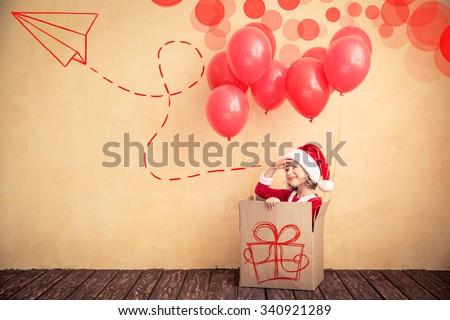 Child playing at home. Christmas gift. Xmas holiday concept