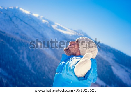 Freedom concept winter holiday vacation mountain man