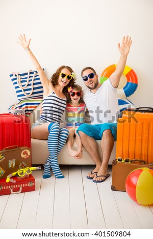 Happy family ready for a summer vacation. Father, mother and child having fun at home