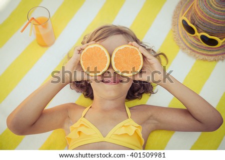 Happy child on the beach. Kid having fun outdoors. Summer vacation concept. Top view portrait