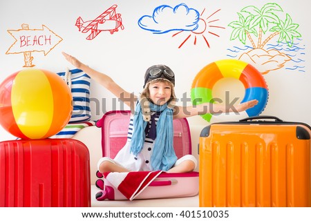 Happy child ready for a summer vacation. Kid having fun at home