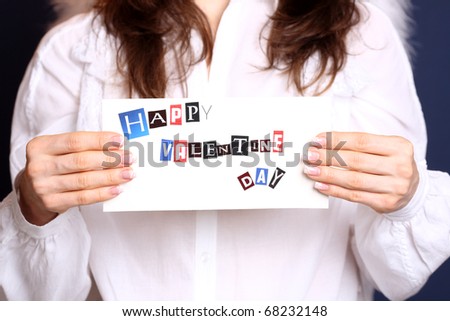 Happy Valentine`s day card in angel hands