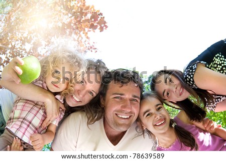 Happy family having fun in summer park