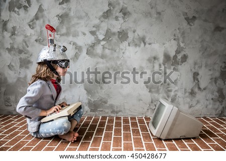 Portrait of young child pretend to be businessman. Nerd kid with toy virtual reality headset. Child geek playing at home. Kid having fun indoors. Success, creative and innovation technology concept