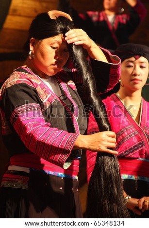 LONGJI, CHINA - SEPTEMBER 20: The Long Hair Women Show in Longji Yao Village, China on September 20, 2010
