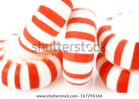 Red striped peppermints on a white background