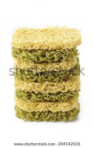dried green noodles and dried noodles on white background