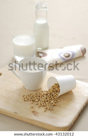 soybean and soy milk on wood background