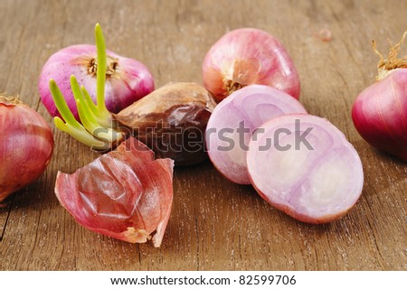 Small red Onions on wood