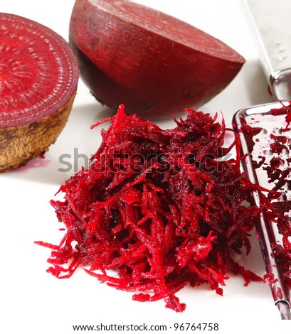 grated beets on a white