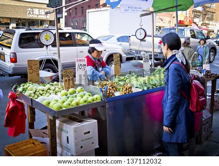 NEW YORK - APRIL 27: A sidewalk produce stand in China Town, New York City on April 27 2013 in New York City. Chinatown is home to the largest amount of Chinese people in the Western hemisphere.