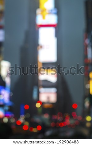 An abstract blur view of Times Square in New York City.