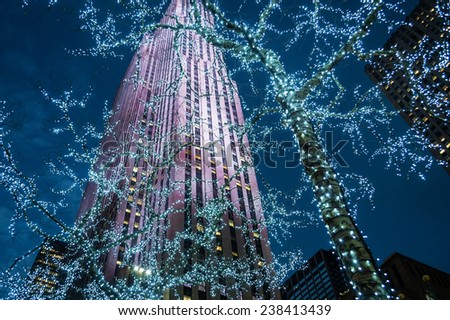 NEW YORK-DECEMBER 12: Looking up at the skyscraper and Christmas lights in Rockefeller Center during the holiday season on December 12, 2014 in Manhattan.