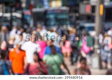 An abstract blur of a crowded New York City street scene.