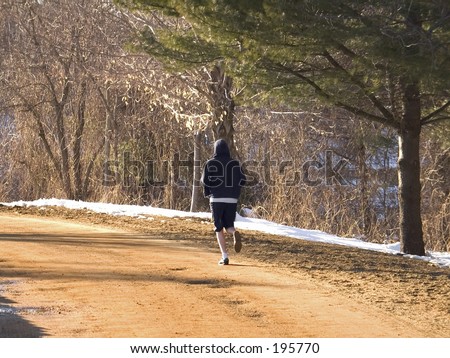 Country Road Runner\
\
\
\
This is a shot of a runner along a dirt road through the country.