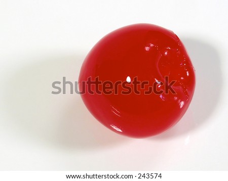 This is a super macro shot of a single maraschino cherry.