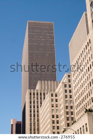 This is a detailed shot of a skyscraper in New York City against a rich blue sky.