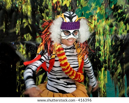 This is a shot of a dancer dressed in a colorful tiger costume.