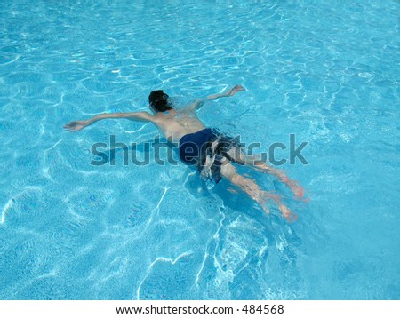 This is a shot of a man swimming underwater.