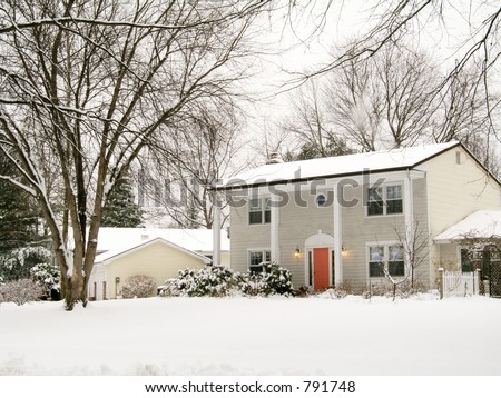 This is a shot of a nice colonial home after an early morning snow.