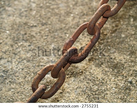 A close-up of a some rusty old chain links.