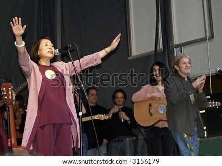 United Nations representative Audrey Kitagawa,  gives a blessing to the crowd at the Earth Day Celebration, featuring Jon Anderson and Paul Green's 