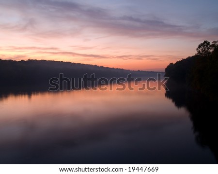 An early morning sunrise view of the Delaware River near Washington Crossing State Park in Pennsylvania.