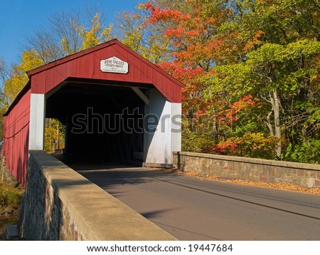 An Autumn view of the historic Pine Valley Covered Bridge located in Bucks County, Pennsylvania.
