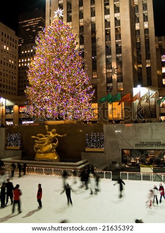 Rockefeller Center, New York, Dec 5th 2008: Ice skaters and tourists are all around the famous Rockefeller Center Christmas tree during the holidays.