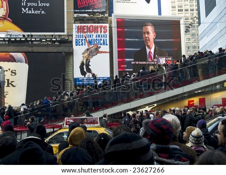 TIMES SQUARE, NEW YORK CITY, JANUARY 20, 2009: Big crowds observe history in Times Square, NY as Barack Obama is inaugurated as the 44th President of the United States.