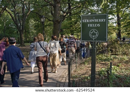 MANHATTAN - OCTOBER 7: Tourists visit Strawberry Fields at Central Park to commemorate John Lennon\'s 70th Birthday on October 9th, 2010 in Manhattan.
