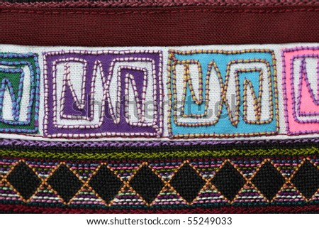 A sample of woven ethnic cloth fabric taken in close up. Fabric is woven by a minority tribe living in the mountainous regions of Thailand and China