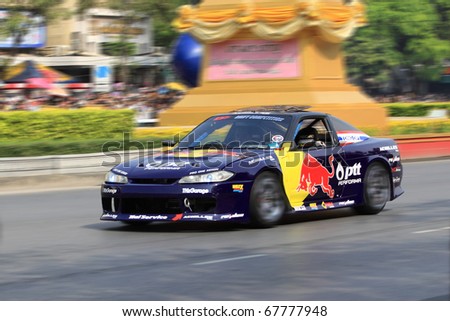 BANGKOK,THAILAND - DECEMBER 18: Red Bull Racing Team speeding shows on Street of Kings, Ratchadamnoen Red Bull Bangkok 2010. December 18, 2010 in Bangkok,Thailand