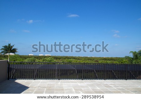 View of Bonita Springs Florida from a large empty roof deck.