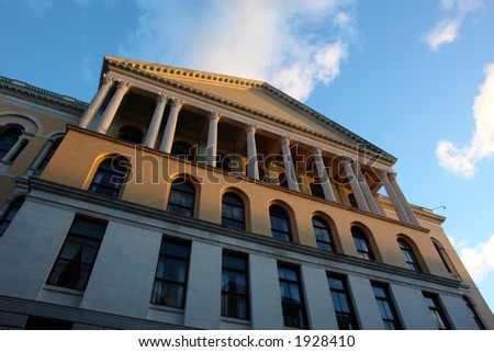 Unusual view of the Massachusetts State House at Sunset against a deep blue sky in early fall 2006