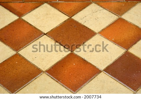diamond pattern of outdoor tiles in the rain,