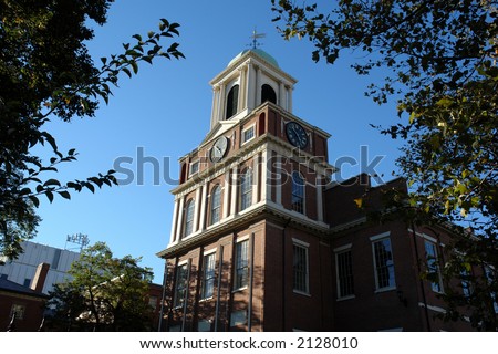 red brick colonial church with white trim and clock tower and bell tower in boston