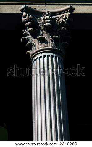 very ornate detailed column with deep shadows to show off the detail