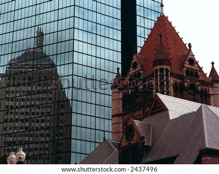 Mixing  old  with the new is one of Boston's specialties. Here we can see the Trinity Church in the fore ground, in the back ground we see an older structure reflected off of a new modern sky scraper.
