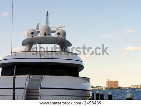 top of ship with a deep blue sky  and white textured clouds leaving lots of room for text