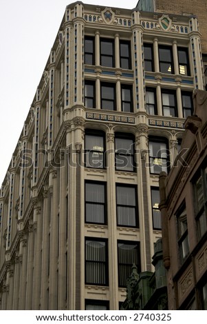 tall skinny fancy high rise office building, very ornate, either victorian or art deco, boston
