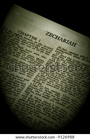 Bible Series. close up detail of antique holy bible open to the book of Zechariah in the old testament finished in sepia