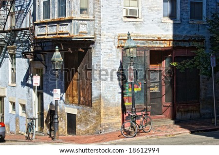 old abandoned corner shop with bordered up windows