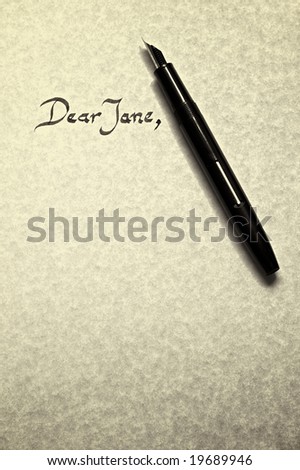dear jane letter being written in calligraphy on parchment paper with pen