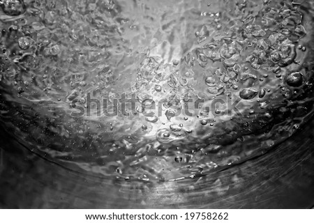 abstract image of pot of very hot water being brought to a high rolling boil