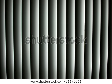 Closed vertical window blinds with sun light shining through make up this abstract image, suitable as a background or wallpaper
