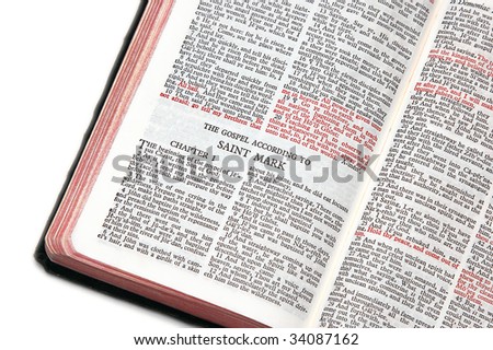 holy bible open to the gospel according to saint mark, against a white background