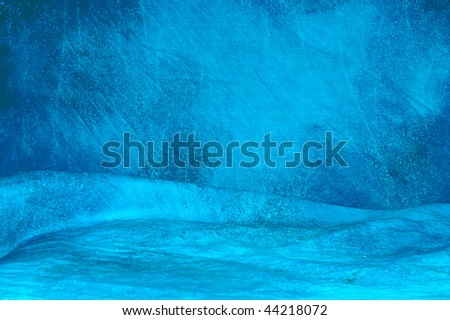 A blue mottled backdrop cloth with wrinkles.